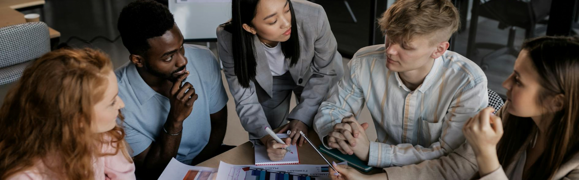Employees receiving career development training from an HR Specialist