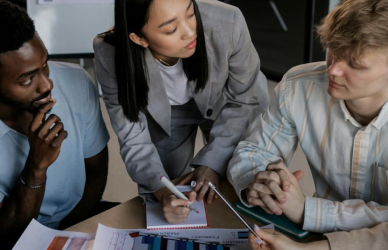 Employees receiving career development training from an HR Specialist